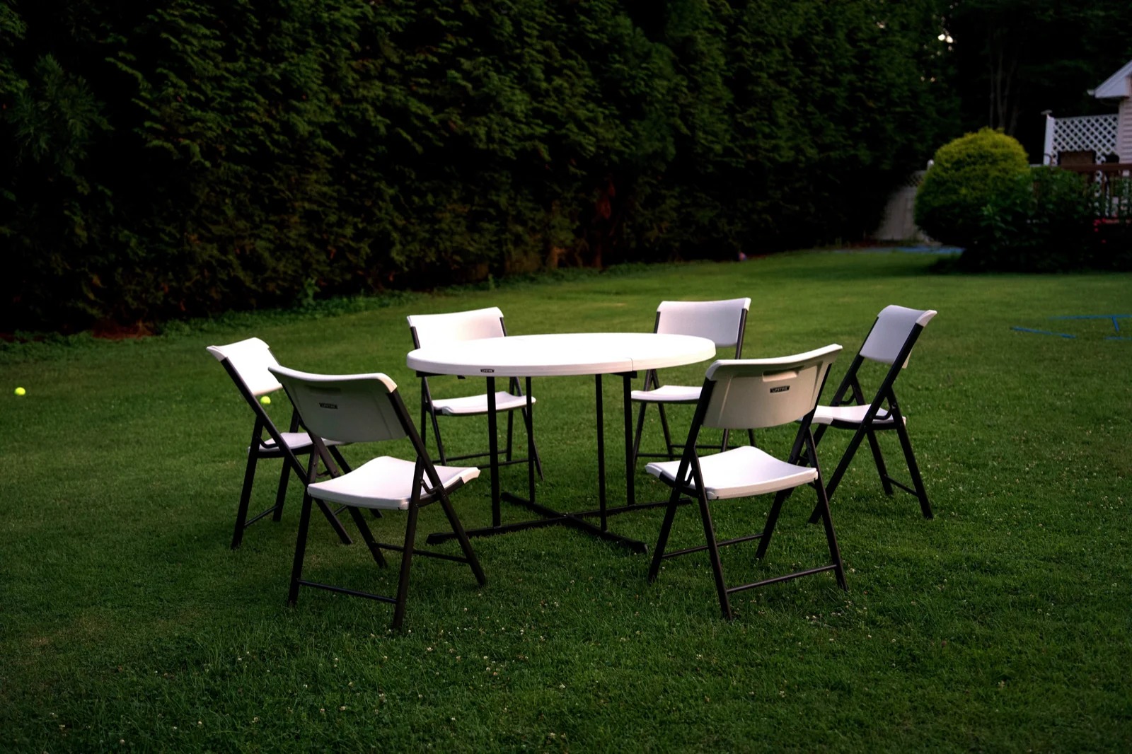 Round folding table with chairs arranged for guests